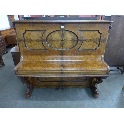 122 - A Victorian burr walnut Pohlmann & Son, Patent Escapement Action overstrung upright piano. With non-... 