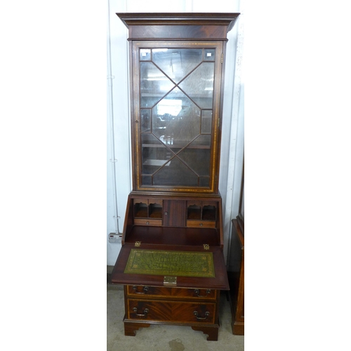 123 - A Regency style inlaid mahogany bureau bookcase