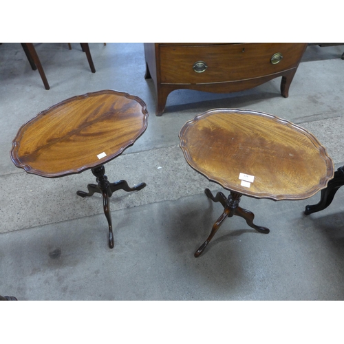 134 - A pair of Regency style mahogany tripod wine tables