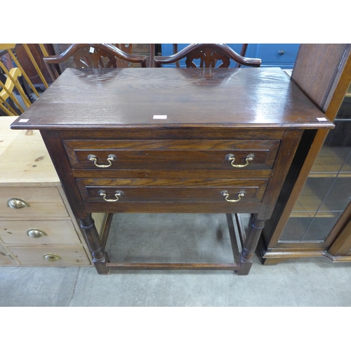 150 - A George III style Ipswich oak two drawer side table