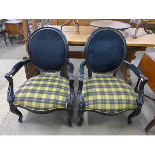 158 - A pair of French style ebonised and fabric upholstered fauteuil chairs