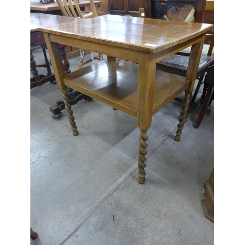 160 - An oak barleytwist two tier side table