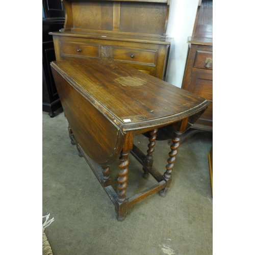 163 - An oak barleytwist gateleg table and an oak dresser