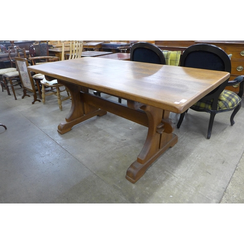 172 - A French oak extending refectory table