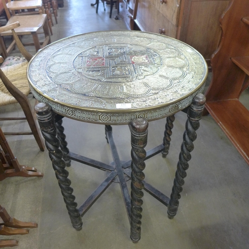 173 - An Islamic brass topped oak barleytwist folding occasional table