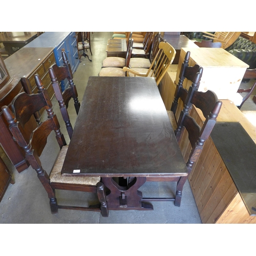 181 - An oak refectory table and four chairs