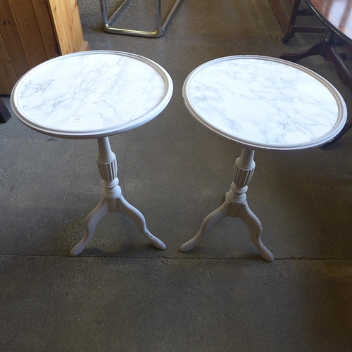 183 - A pair of painted tripod wine tables, with faux marble tops