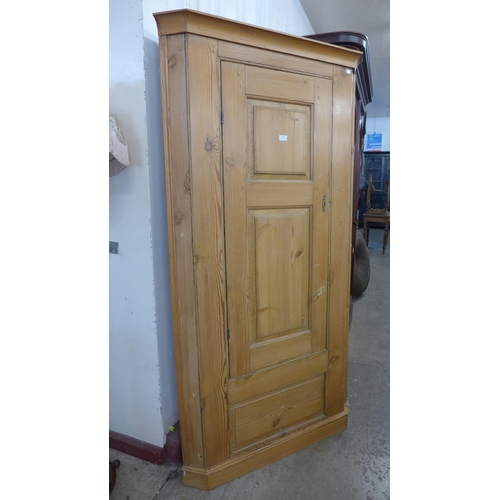 201 - A George III pine freestanding corner cupboard