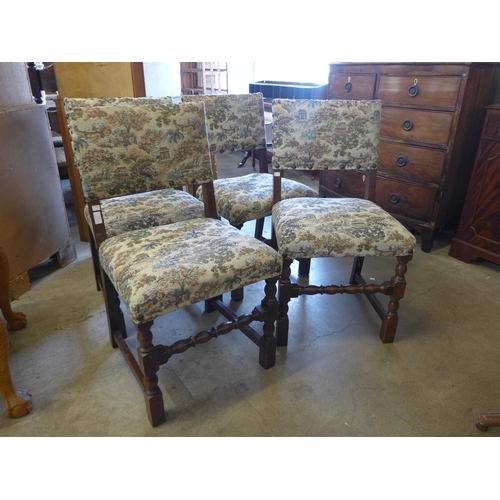 213 - A set of four oak dining chairs