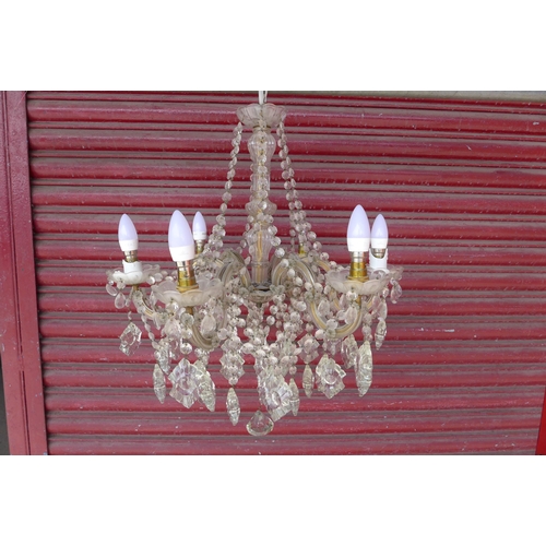 219 - A French glass six branch chandelier