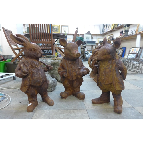 228 - A set of three cast iron Beatrix Potter garden figures