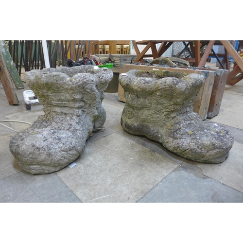 230 - A pair of concrete boot shaped garden planters