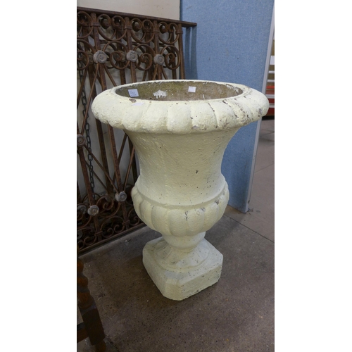 240A - A painted concrete campana shaped garden urn