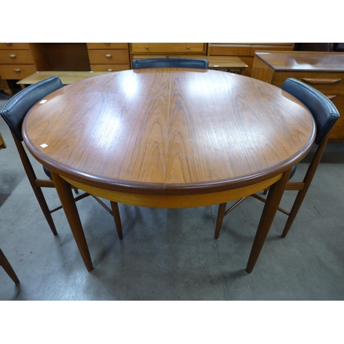 26 - A G-Plan Fresco circular teak extending dining table and six chairs