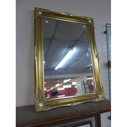 283 - A gilt framed mirror