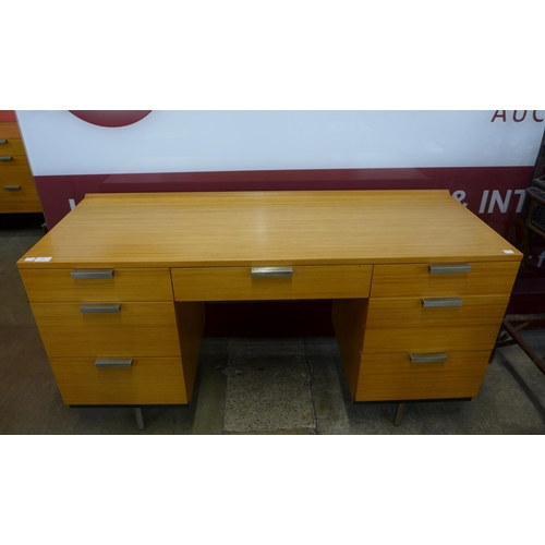 29 - A Stag Fineline teak desk, designed by John & Sylvia Reid