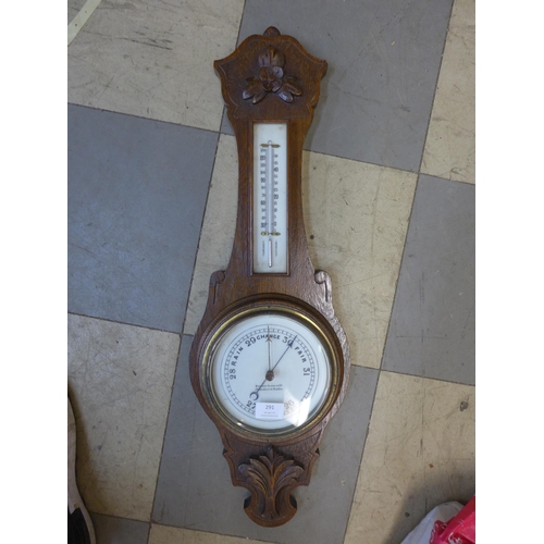 291 - An Edward VII carved oak aneroid barometer