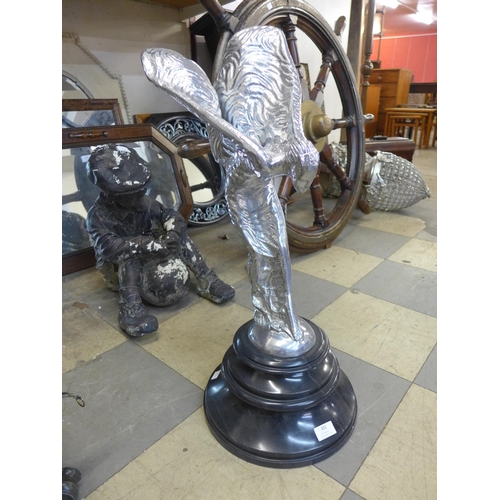 302 - A large chrome effect Spirit of Ecstasy figure, on black marble socle