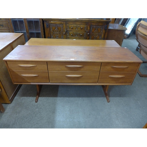 43 - An Austin Suite teak six drawer sideboard