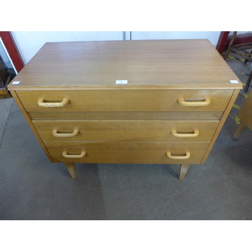 50 - A teak chest of drawers