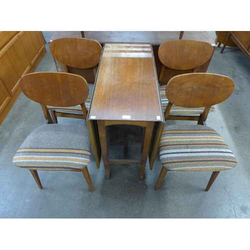 66 - A teak drop-leaf table and four chairs