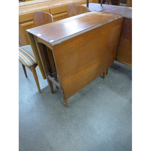 66 - A teak drop-leaf table and four chairs