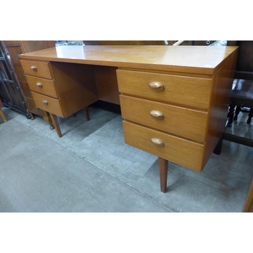 72 - An Austin Suite teak desk