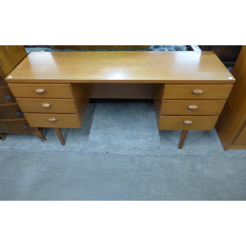 72 - An Austin Suite teak desk