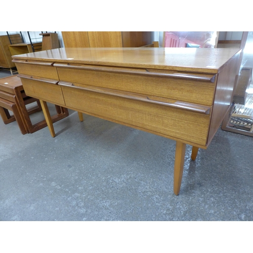 73 - An Avalon teak four drawer sideboard