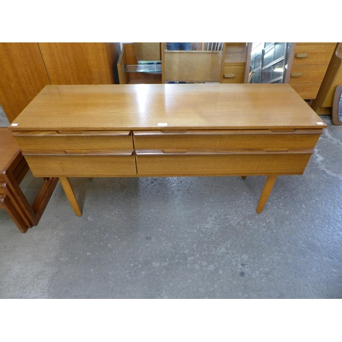 73 - An Avalon teak four drawer sideboard