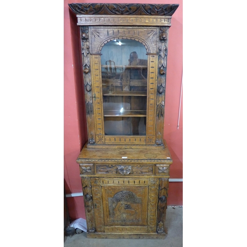 96 - A 19th Century French carved oak green man bookcase