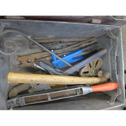 2051 - A box of hand tools including large spanner, pick axe, screwdrivers, etc.