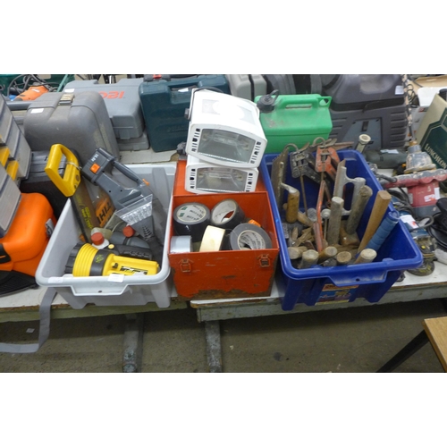 2065 - A large quantity of tools, petrol cans, tool boxes, masking tape torch, saws etc.