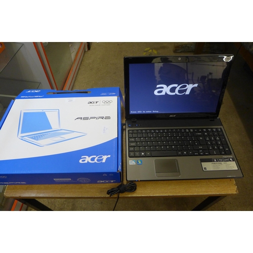 2157 - An Aspire Acer laptop powers up (charger and box, no operating system)