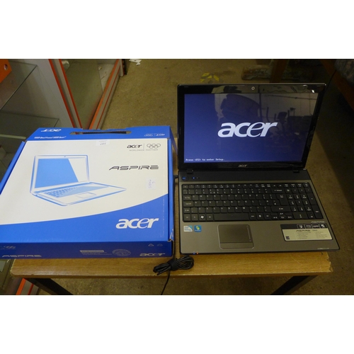 2157 - An Aspire Acer laptop powers up (charger and box, no operating system)