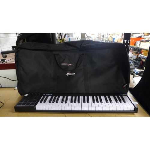 2167 - An Alesis V49 electric keyboard with cables, instructions and carry bag