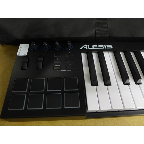 2167 - An Alesis V49 electric keyboard with cables, instructions and carry bag