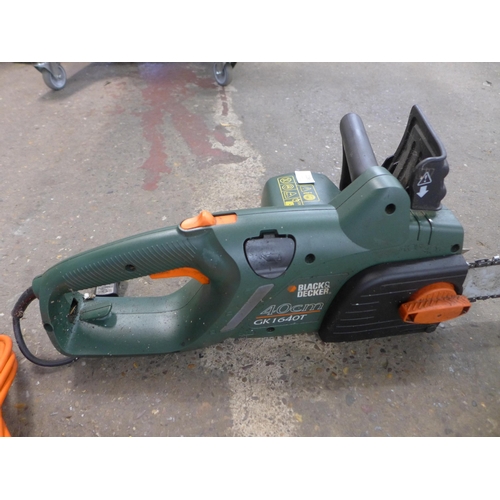 2286 - A Black & decker chainsaw with spare blade, tools and oil (model GK11640T)