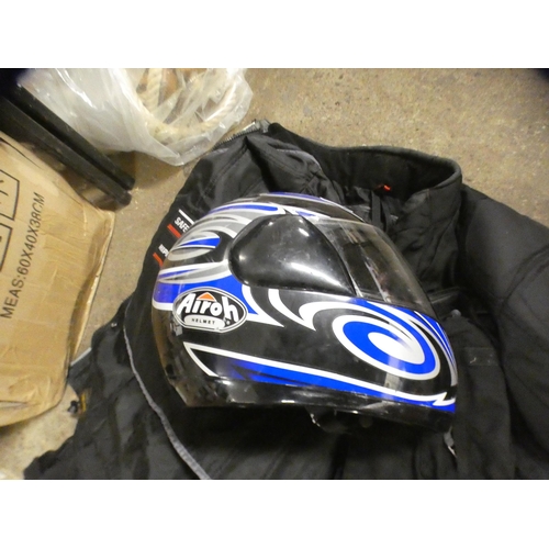 2452 - An Airohi bike helmet with padded motorbike clothes