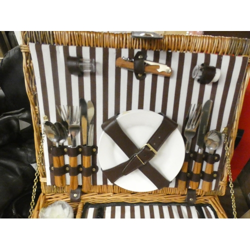 2506 - An as new picnic basket set including knives, forks, spoons, bottle opener, drinking glasses, and a ... 