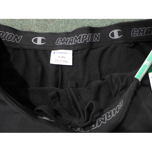 Quantity of Men's black Champion shorts - Size: mainly XL * this lot is  subject to VAT