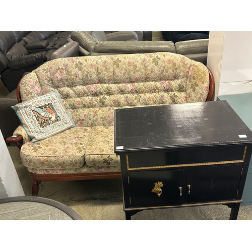 1586 - A dark stained wood and floral upholstered cottage sofa and a black painted cabinet