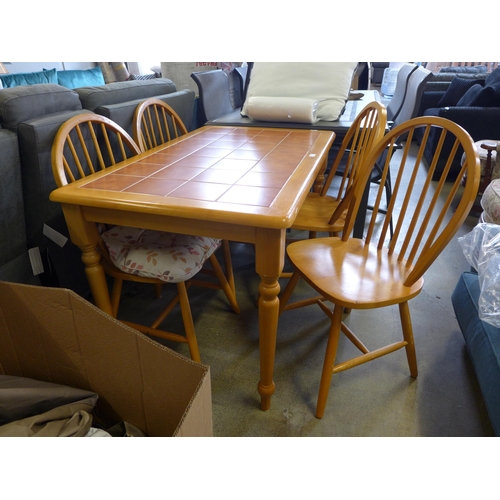 1588 - A beech kitchen dining table with tiled top and four dining chairs