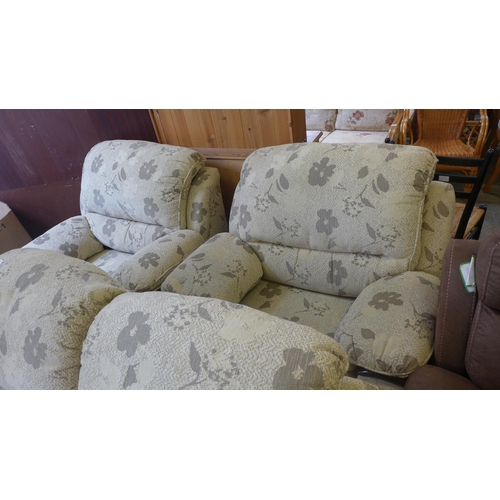 1570 - A cream floral upholstered three piece suite