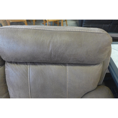 1571 - A brown upholstered two seater reclining sofa