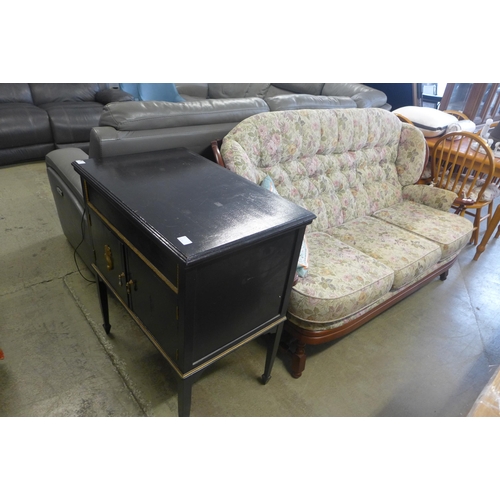 1586 - A dark stained wood and floral upholstered cottage sofa and a black painted cabinet