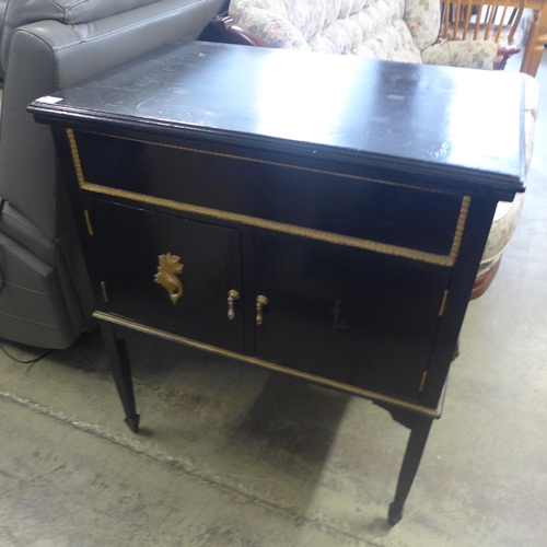 1586 - A dark stained wood and floral upholstered cottage sofa and a black painted cabinet