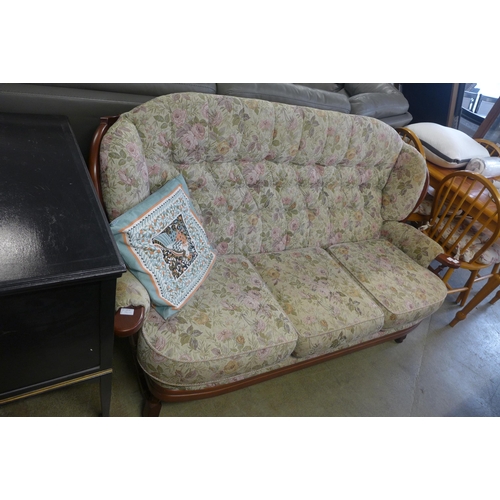 1586 - A dark stained wood and floral upholstered cottage sofa and a black painted cabinet