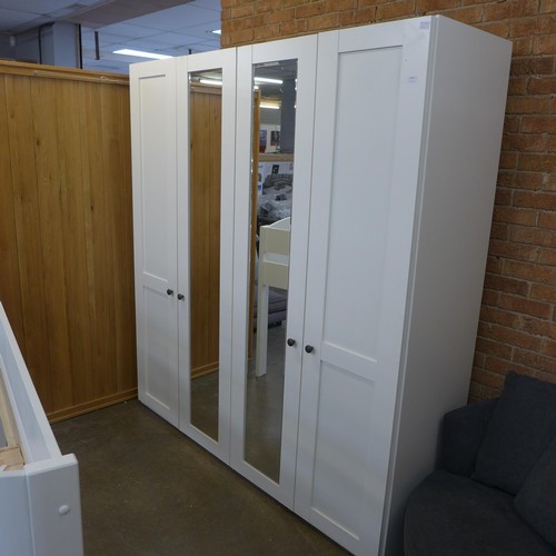 1508 - A four door mirrored wardrobe  *This lot is subject to VAT