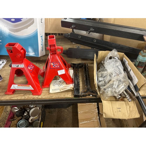 2429 - A pair of axle stands, a bottle jack and a quantity of sockets